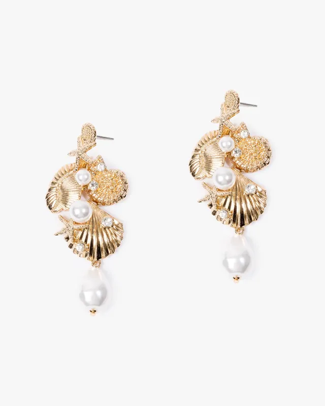 Gold Pearl Embellished Sea Charm Drop Earrings sold by Collete Hayman
