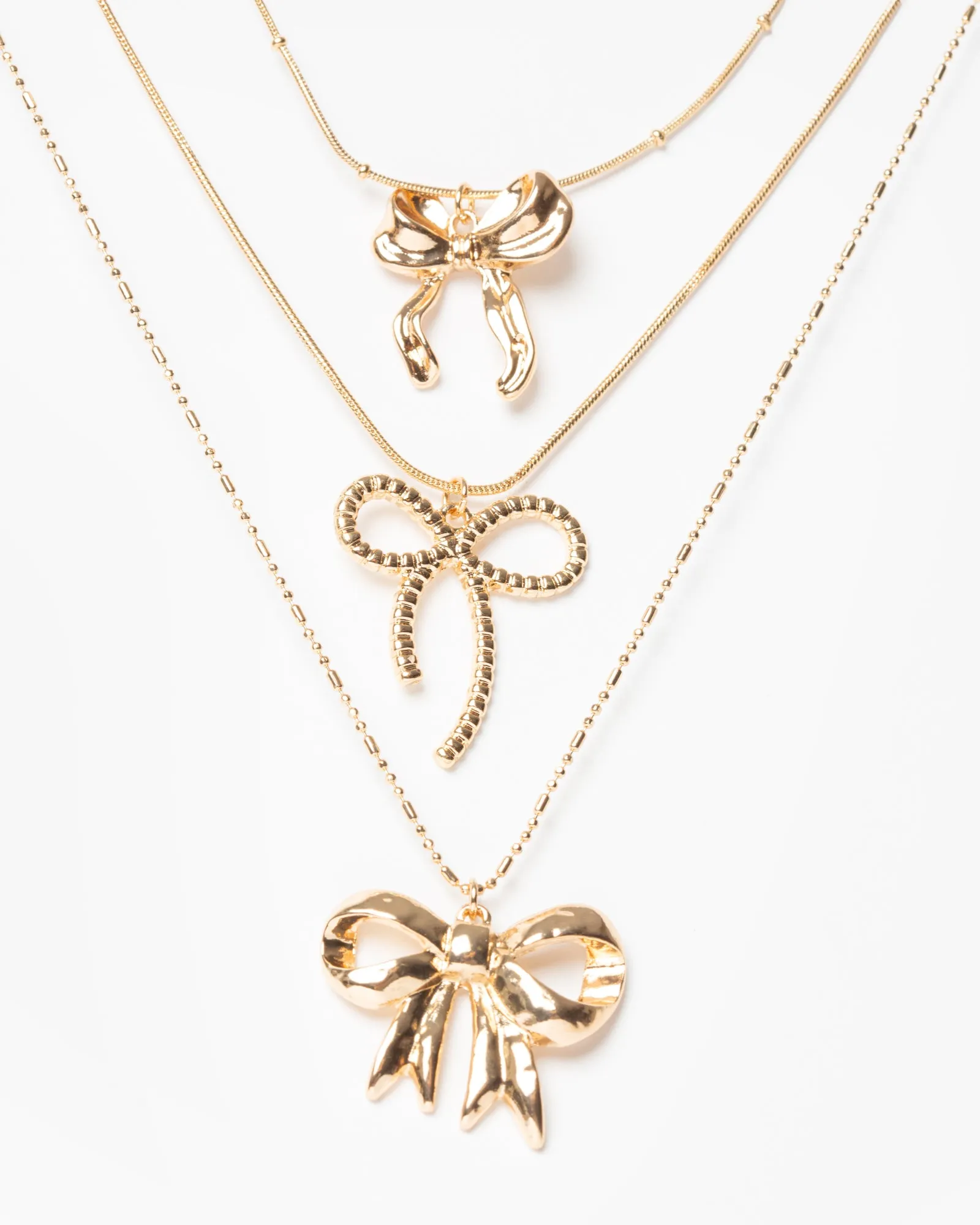 Gold Metal Bow Charm 3 Pack Necklace sold by Collete Hayman product image thumbnail 2