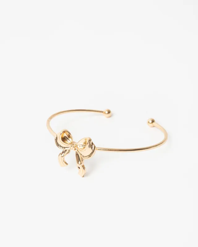 Gold Metal Bow Charm Cuff Bracelet sold by Collete Hayman