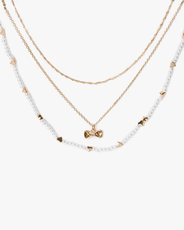Gold Multi Pack Heart And Bow Charm Necklace sold by Collete Hayman