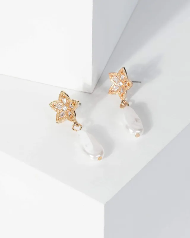 Gold Flower Pearl Drop Earrings sold by Collete Hayman