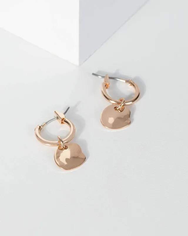 Gold Hammered Disc Huggie Hoop Earrings sold by Collete Hayman