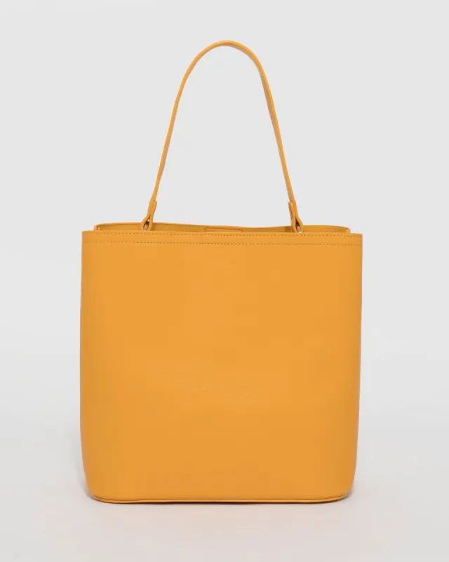 Mustard Melanie Medium Bucket Bag sold by Collete Hayman