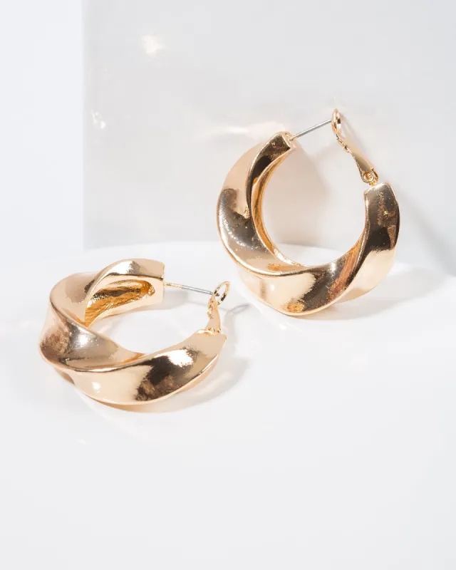 Gold Chunky Twisty Hoop Earrings sold by Collete Hayman
