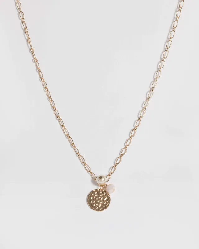 Gold Hammered Disc Pendant Necklace sold by Collete Hayman