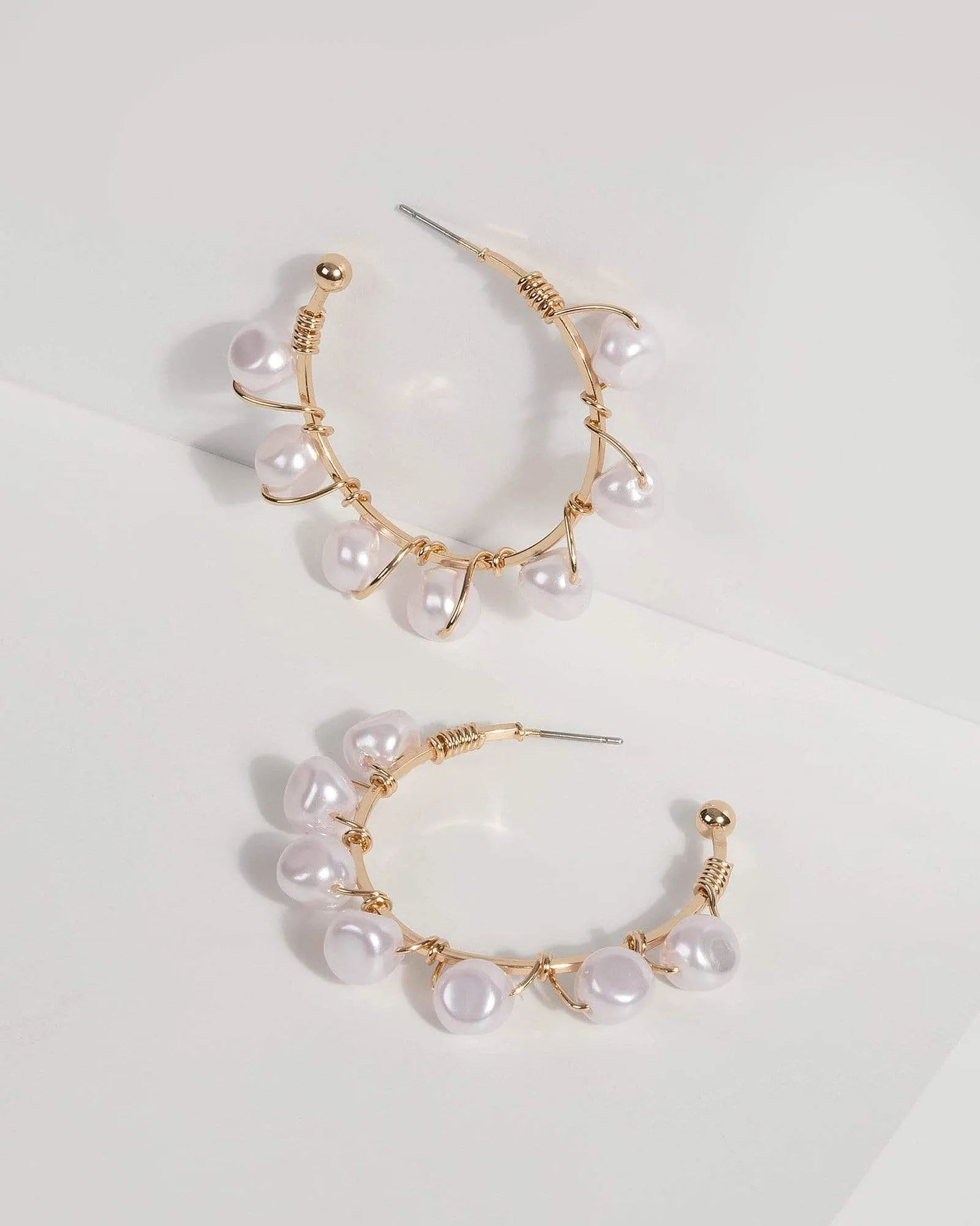 Pearl Wire Hoop Earrings sold by Collete Hayman
