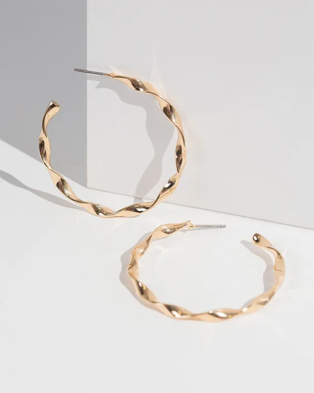 Gold Molten Look Twist Hoop Earrings sold by Collete Hayman