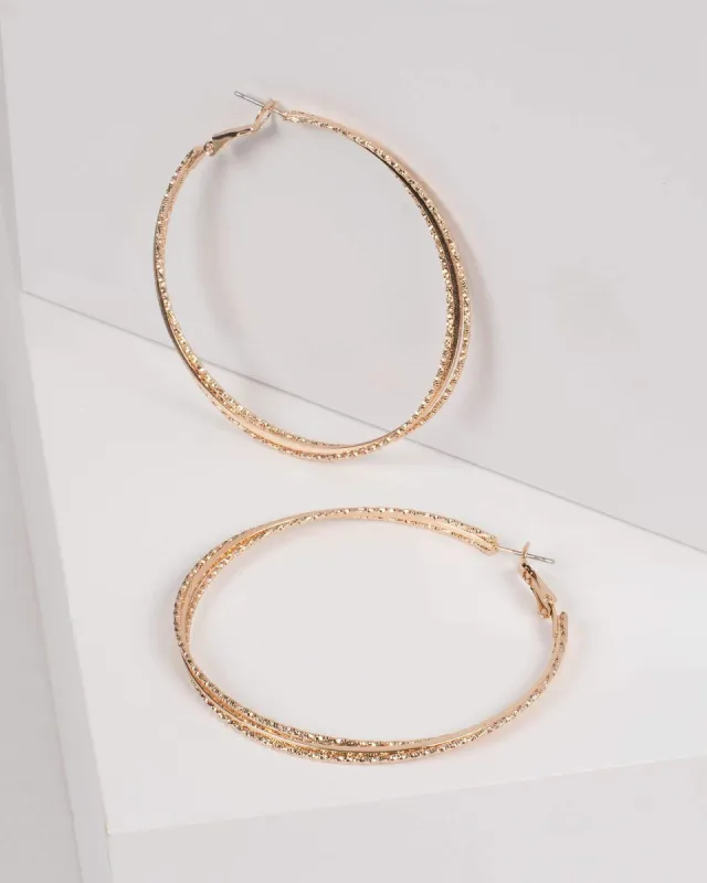 Gold Textured Metal Hoop Earrings sold by Collete Hayman