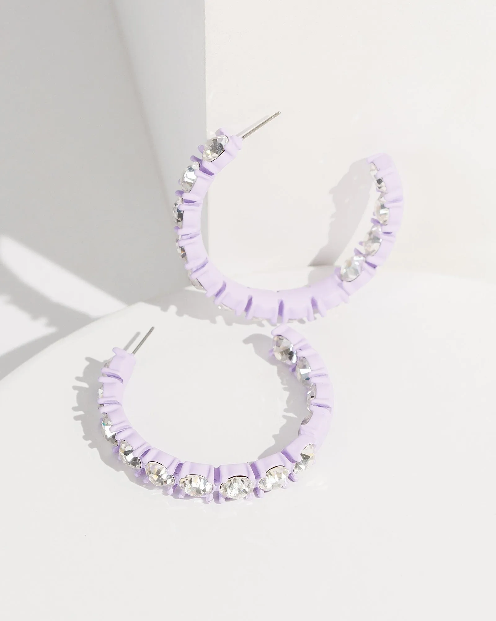 Purple Crystal Around Hoop Earirngs sold by Collete Hayman