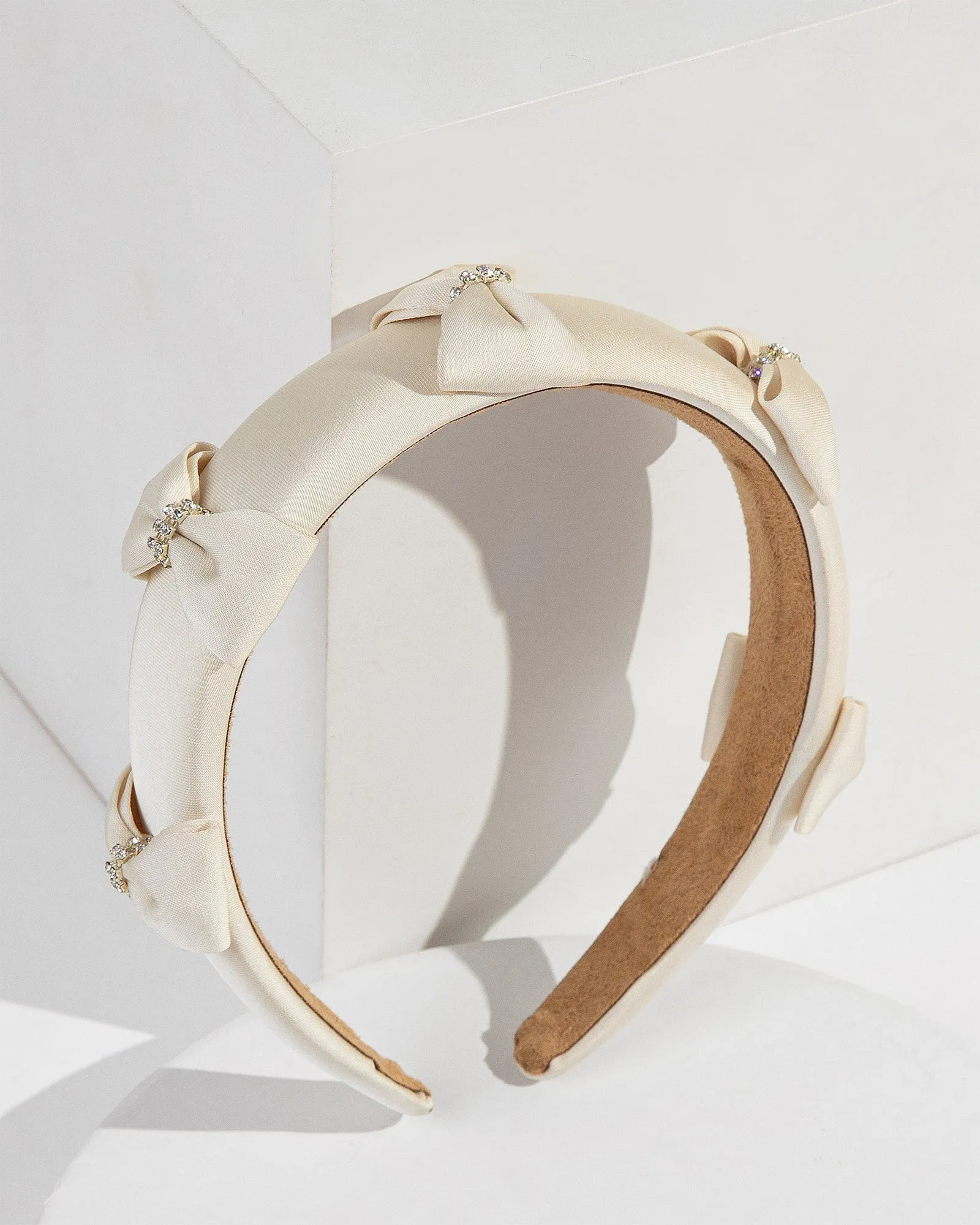 White Multi Crystal Bow Headband sold by Collete Hayman