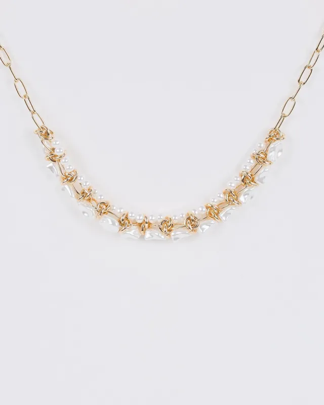 Gold Twisted Metal And Pearl Necklace sold by Collete Hayman