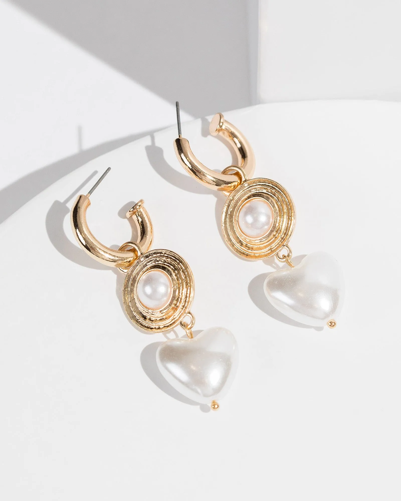 White Heart Pearl Huggie Hoop Earrings sold by Collete Hayman