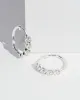 Crystal Huggie Hoop Earrings sold by Collete Hayman