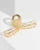 Gold Metal Open Loop Claw Clip sold by Collete Hayman