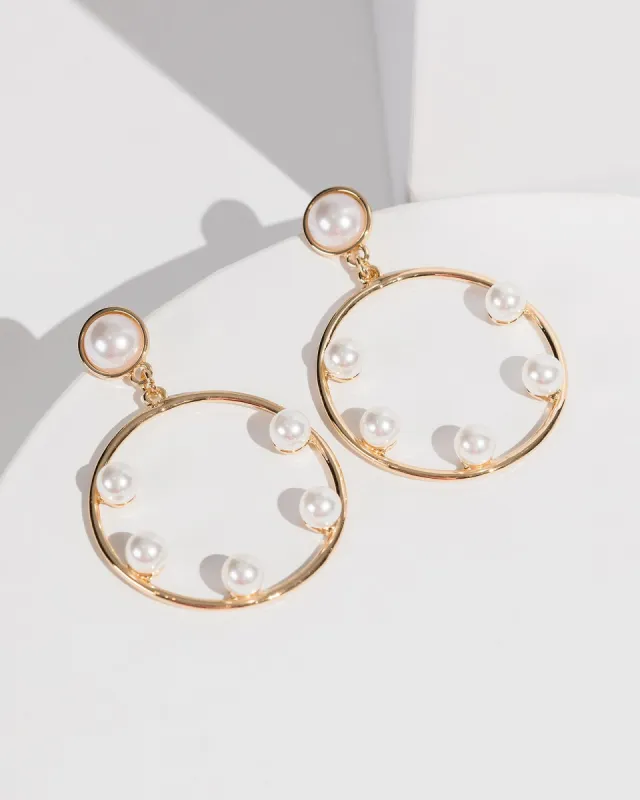 White Pearly Circle Statement Earrings sold by Collete Hayman