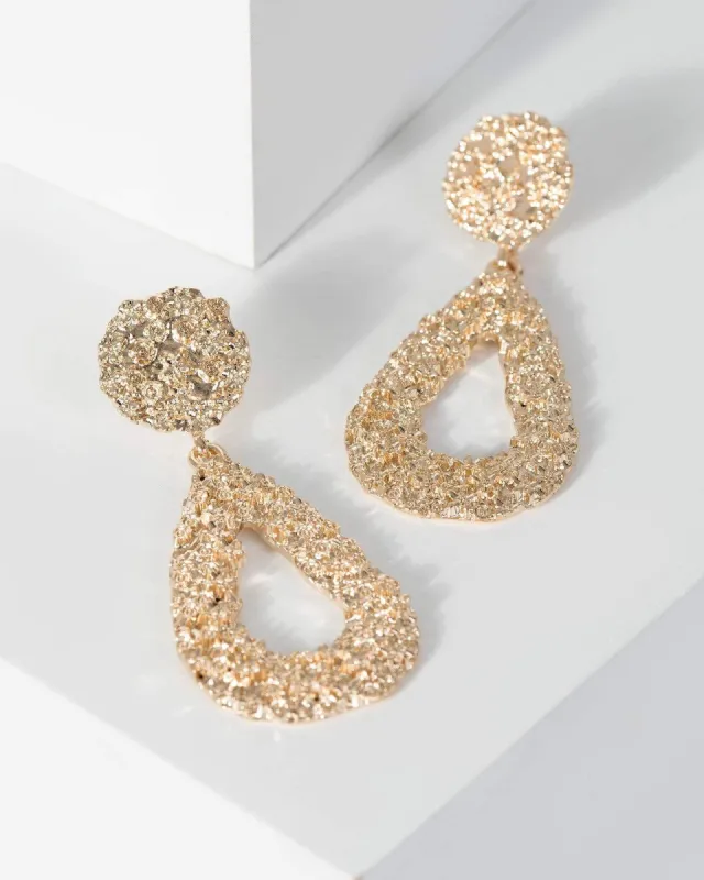 Gold Textured Drop Metal Earrings sold by Collete Hayman