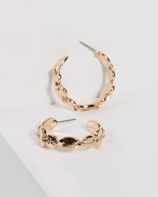 Gold Textured Metal Hoop Earrings sold by Collete Hayman