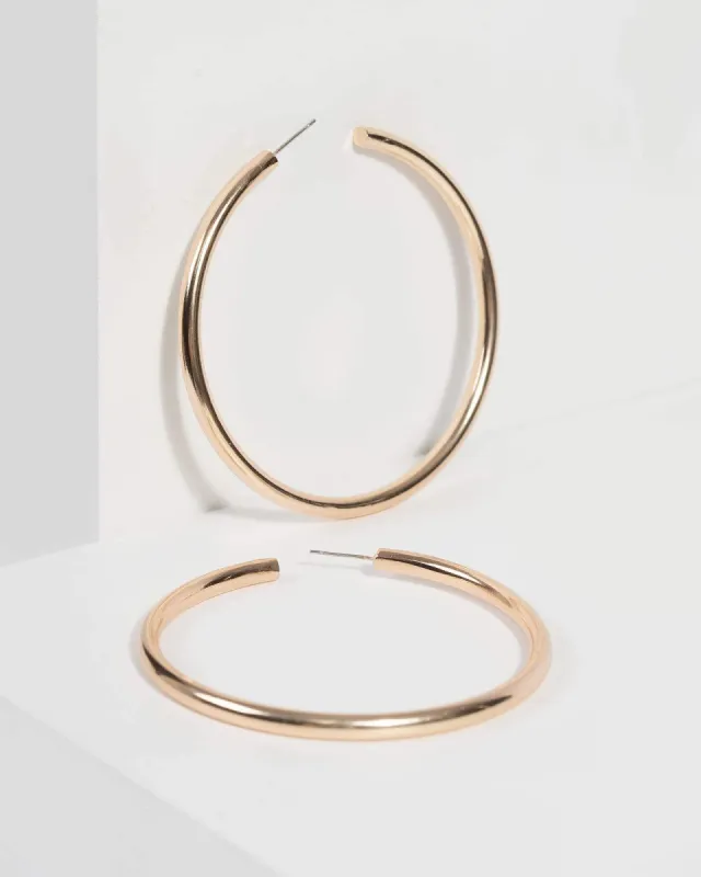 Gold Tube Hoop Drop Earrings sold by Collete Hayman