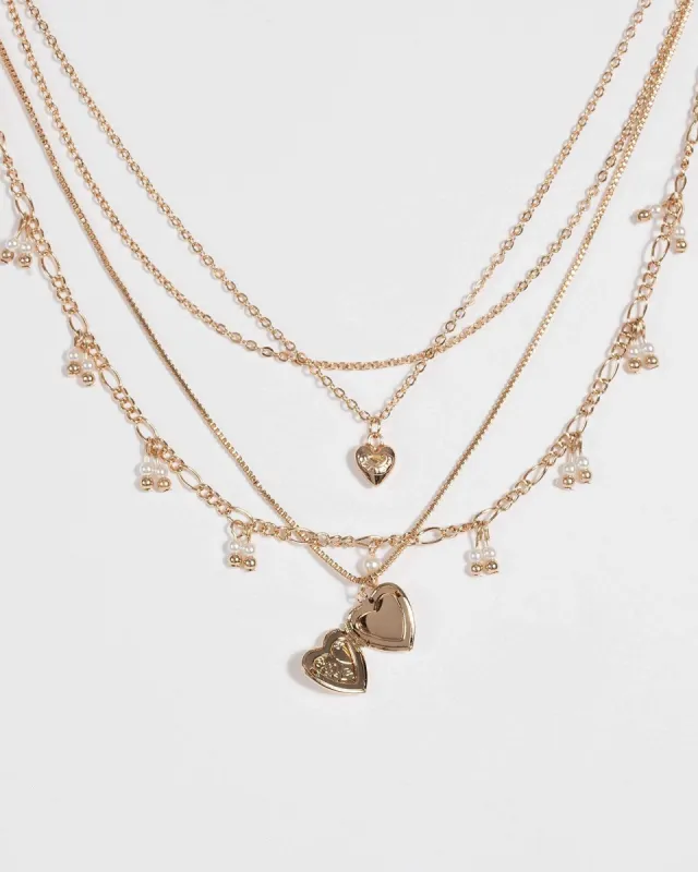 Gold Pearl and Heart Pendant Necklace sold by Collete Hayman