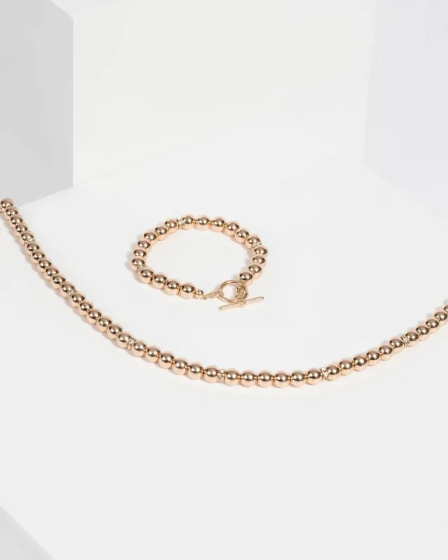 Gold Beaded Necklace and Bracelet Set sold by Collete Hayman