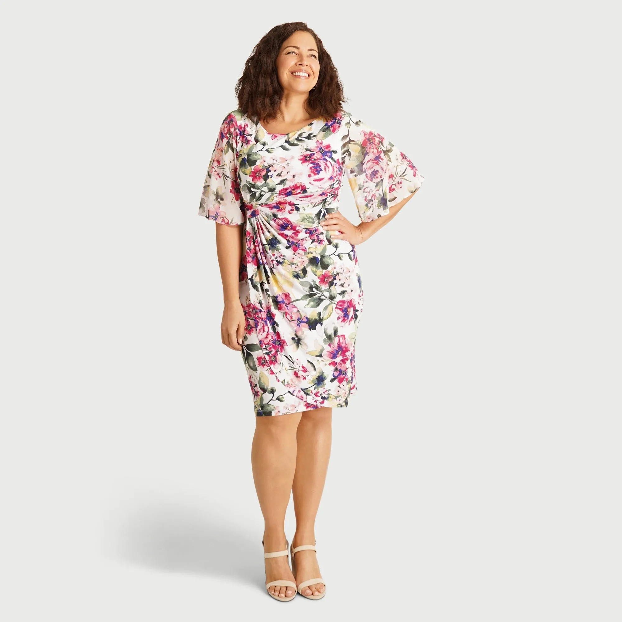 Genieve White Floral Short Sleeve Faux Wrap Dress sold by connected apparel
