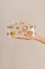 ORBS CLUTCH - SHINY BRASS sold by cult gaia