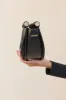 LOU CLUTCH - BLACK sold by cult gaia