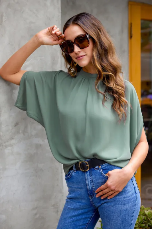 Leah Mock Neck Dolman Sleeve Top sold by Cupshe