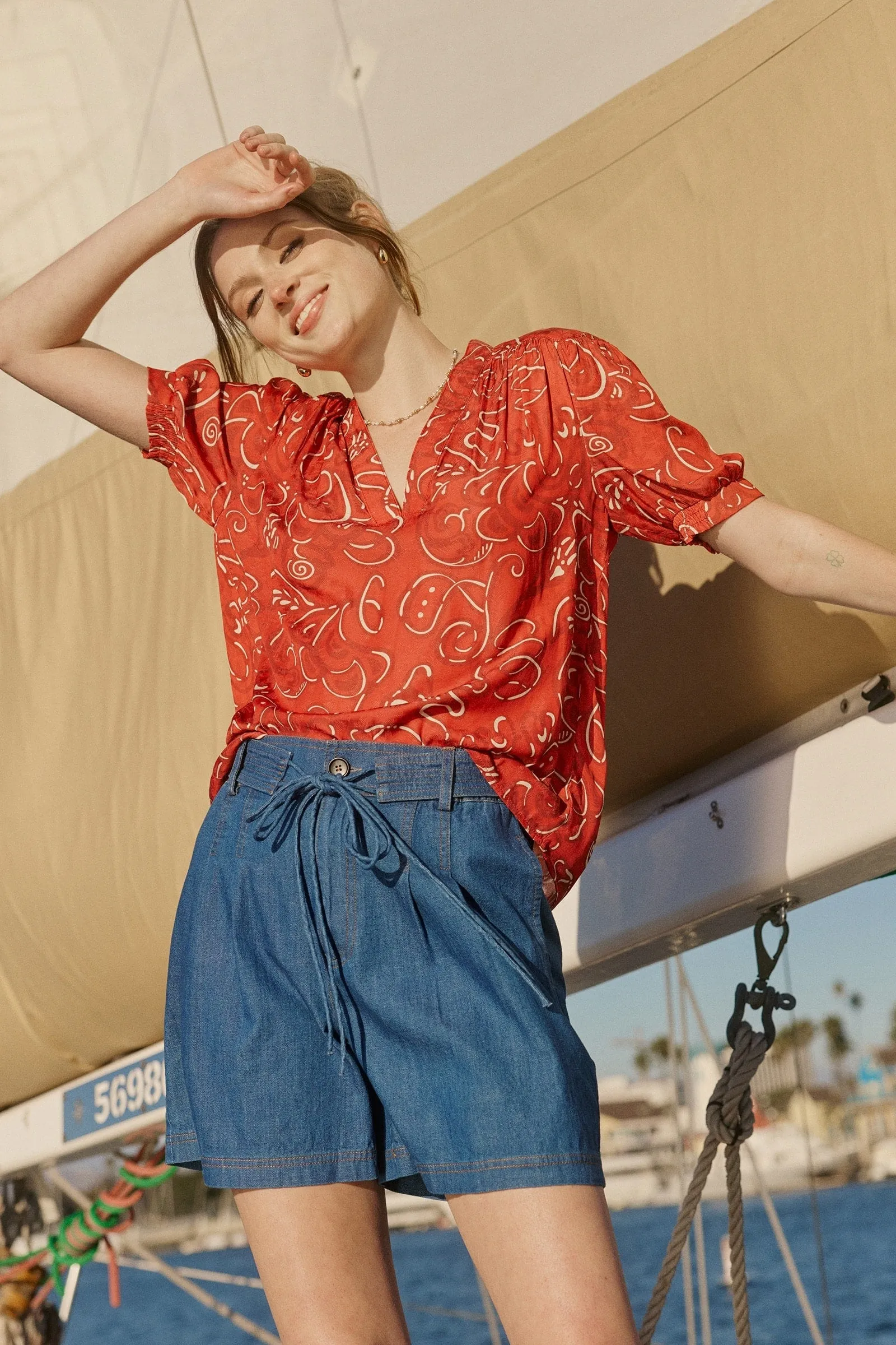 Red pattern blouse sold by Current Air