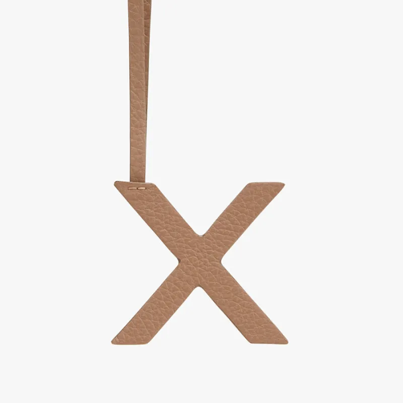 Letter Keychain X sold by Cuyana