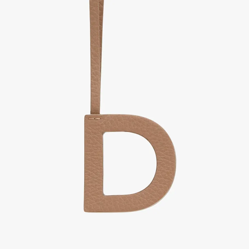 Letter Keychain D sold by Cuyana