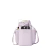 Sloan Water Bottle Sling in Washed Lilac sold by Dagne Dover
