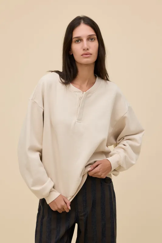 Solid Oversized Henley Sweatshirt made by Daydreamer