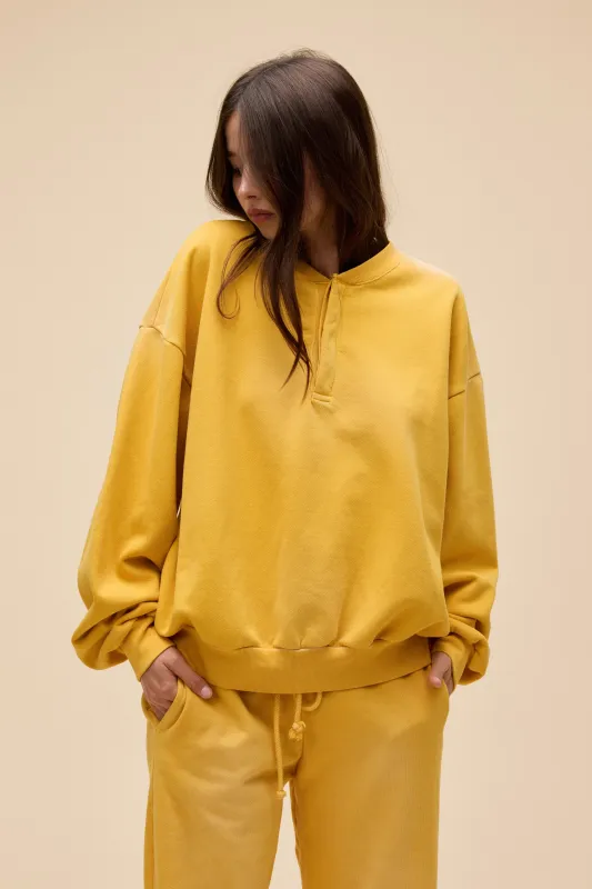 Solid Oversized Henley Sweatshirt made by Daydreamer