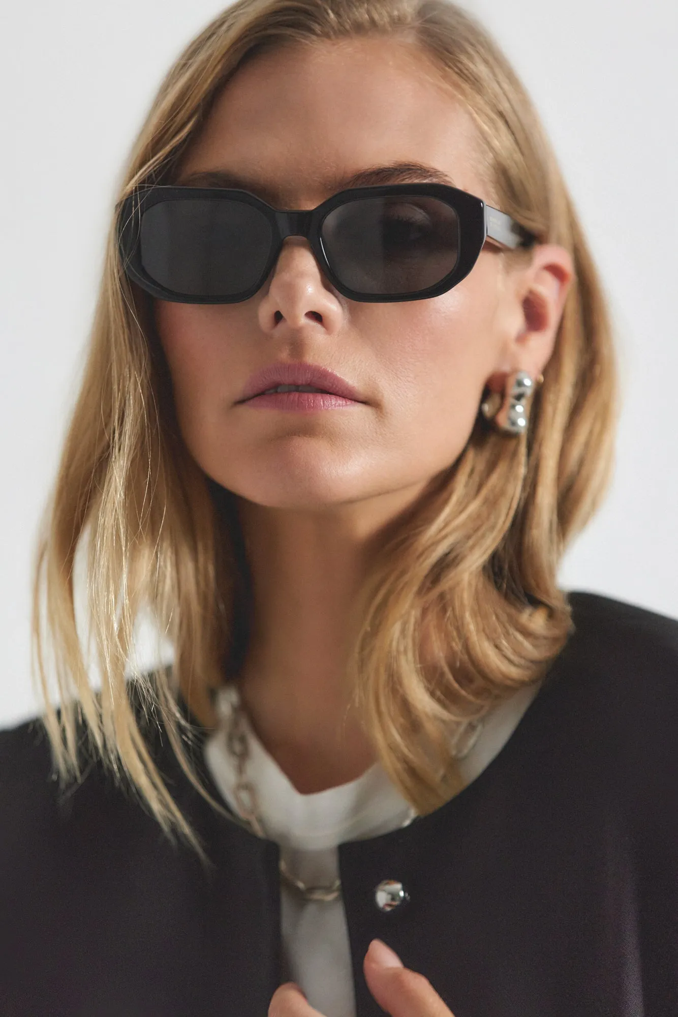 Fidela Angular Chunky Oval Sunglasses - Black sold by Derek Lam
