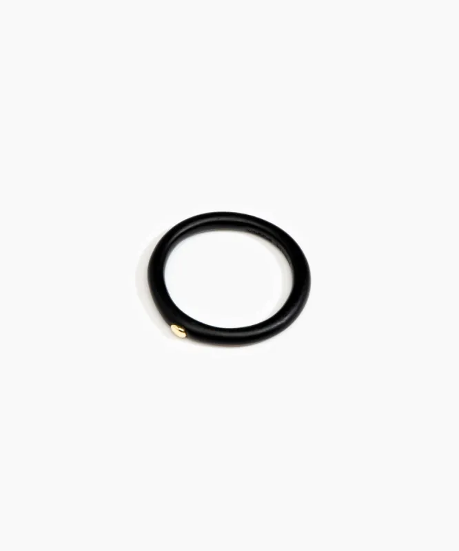 Round Rock Wishbone Bangle sold by Dinosaur Designs