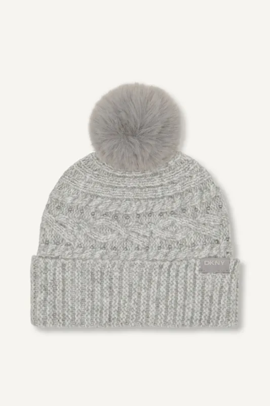 STUDDED CABLE POM HAT sold by DKNY