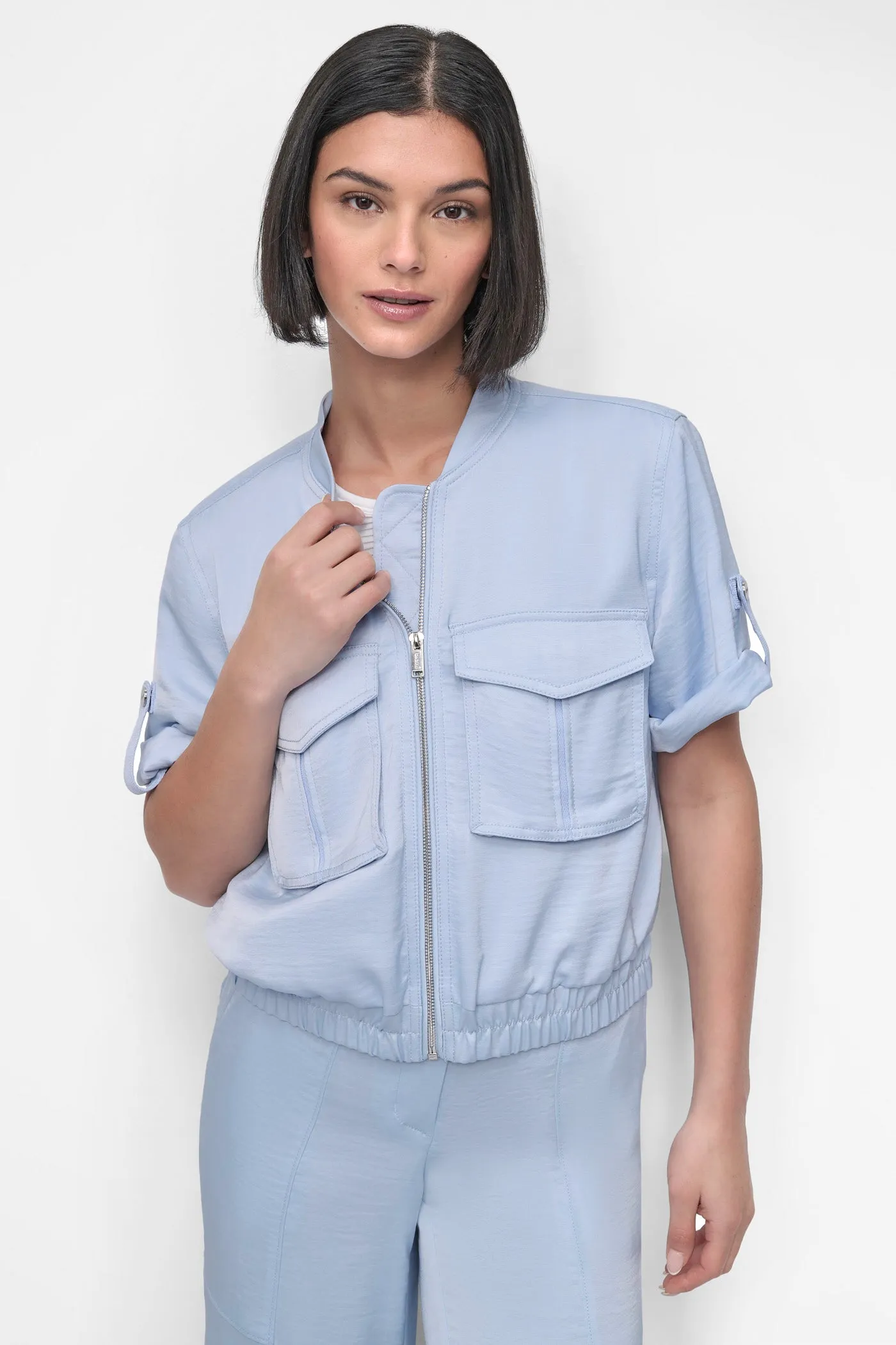 SHORT SLEEVE ROLL TAB ZIP FRONT sold by DKNY