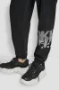 GRAFFITI RHINESTONE LOGO HIGH RISE RELAXED FIT JOGGER sold by DKNY
