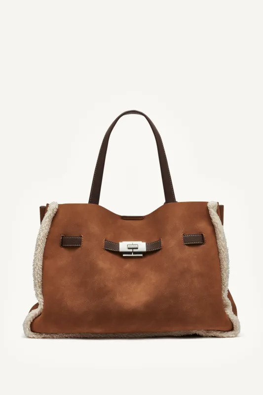 BRYAR LARGE FAUX SHEARLING SATCHEL BAG sold by DKNY