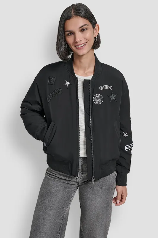LONG SLEEVE NYLON PINS AND PATCHES BOMBER JACKET sold by DKNY