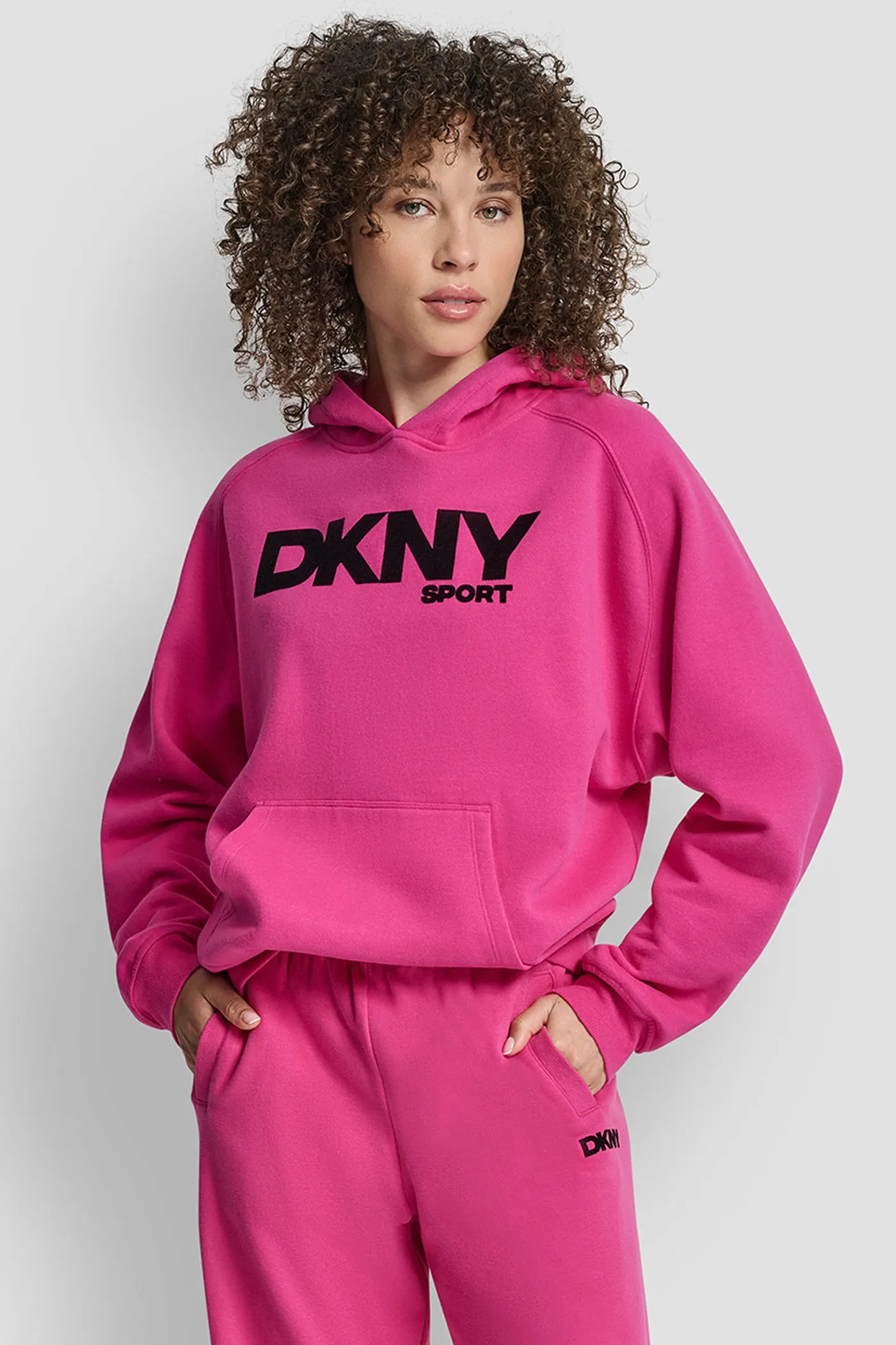 OVERSIZED FLOCKED LOGO PULLOVER HOODIE sold by DKNY