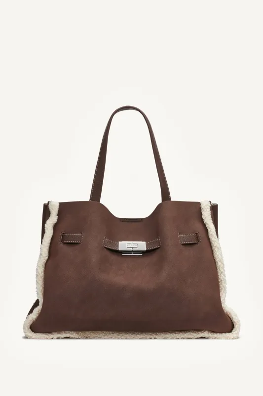 BRYAR LARGE FAUX SHEARLING SATCHEL BAG sold by DKNY