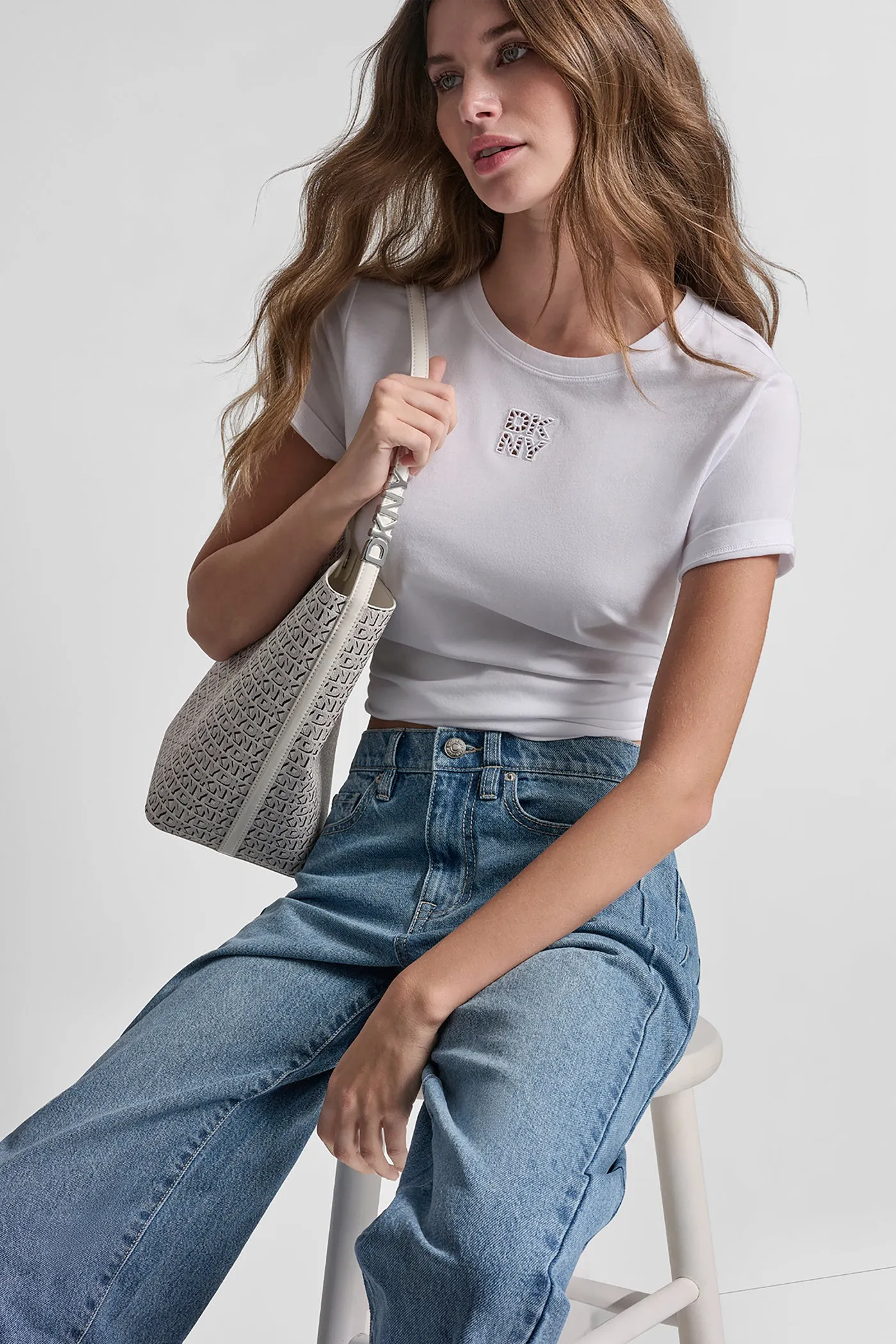 DKNY STACKED EYELET LOGO TEE sold by DKNY