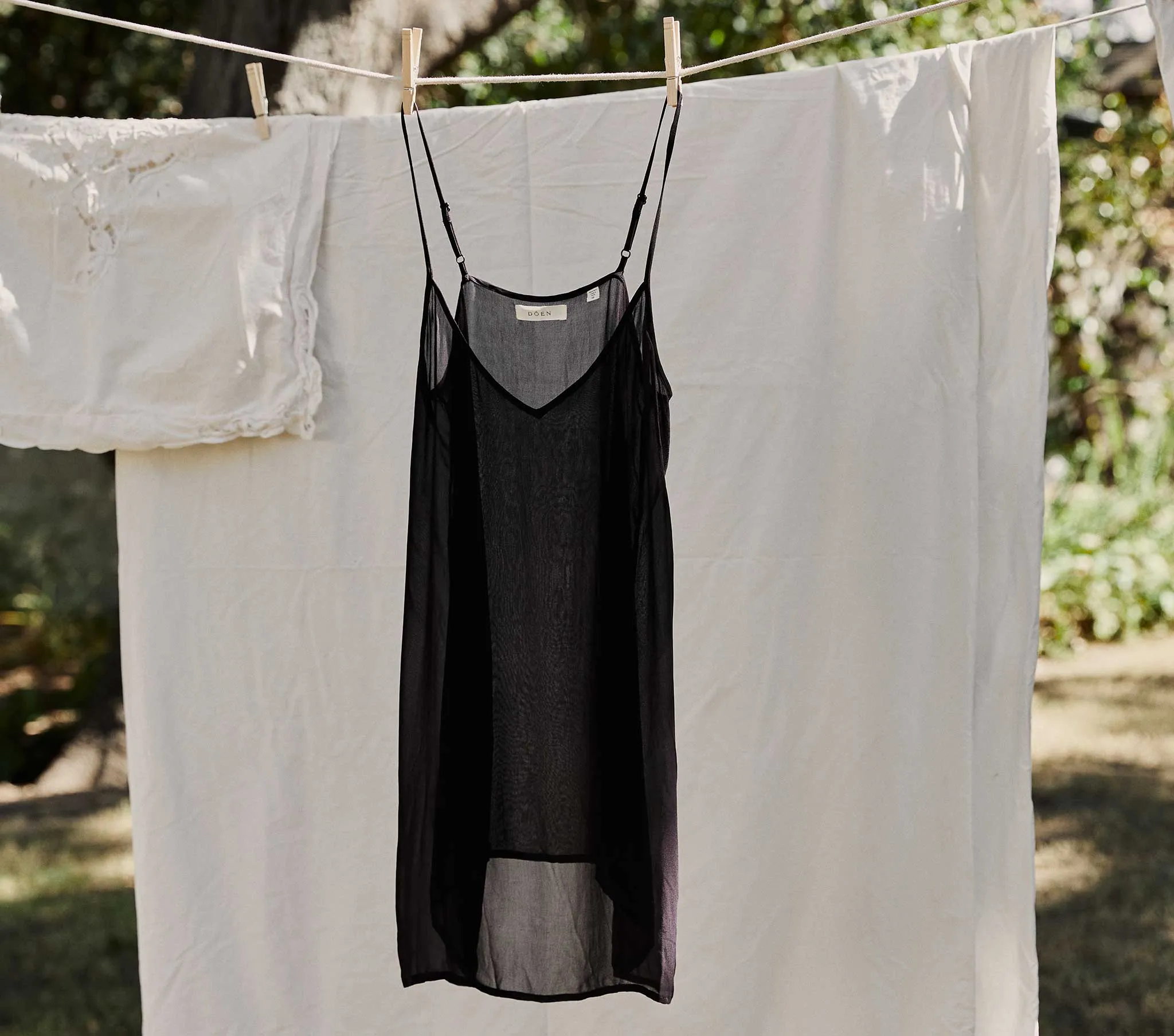 SHORT DEEP V-NECK SLIP -- BLACK sold by Doen