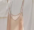 LONG DEEP V-NECK SLIP -- CONCH sold by Doen