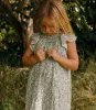 LIESEL DRESS -- PERIDOT TEA FLORAL sold by Doen