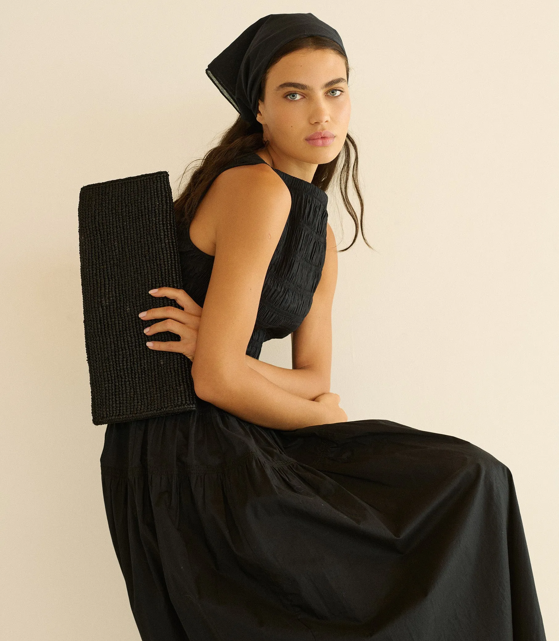 MURIEL CLUTCH -- BLACK RAFFIA sold by Doen