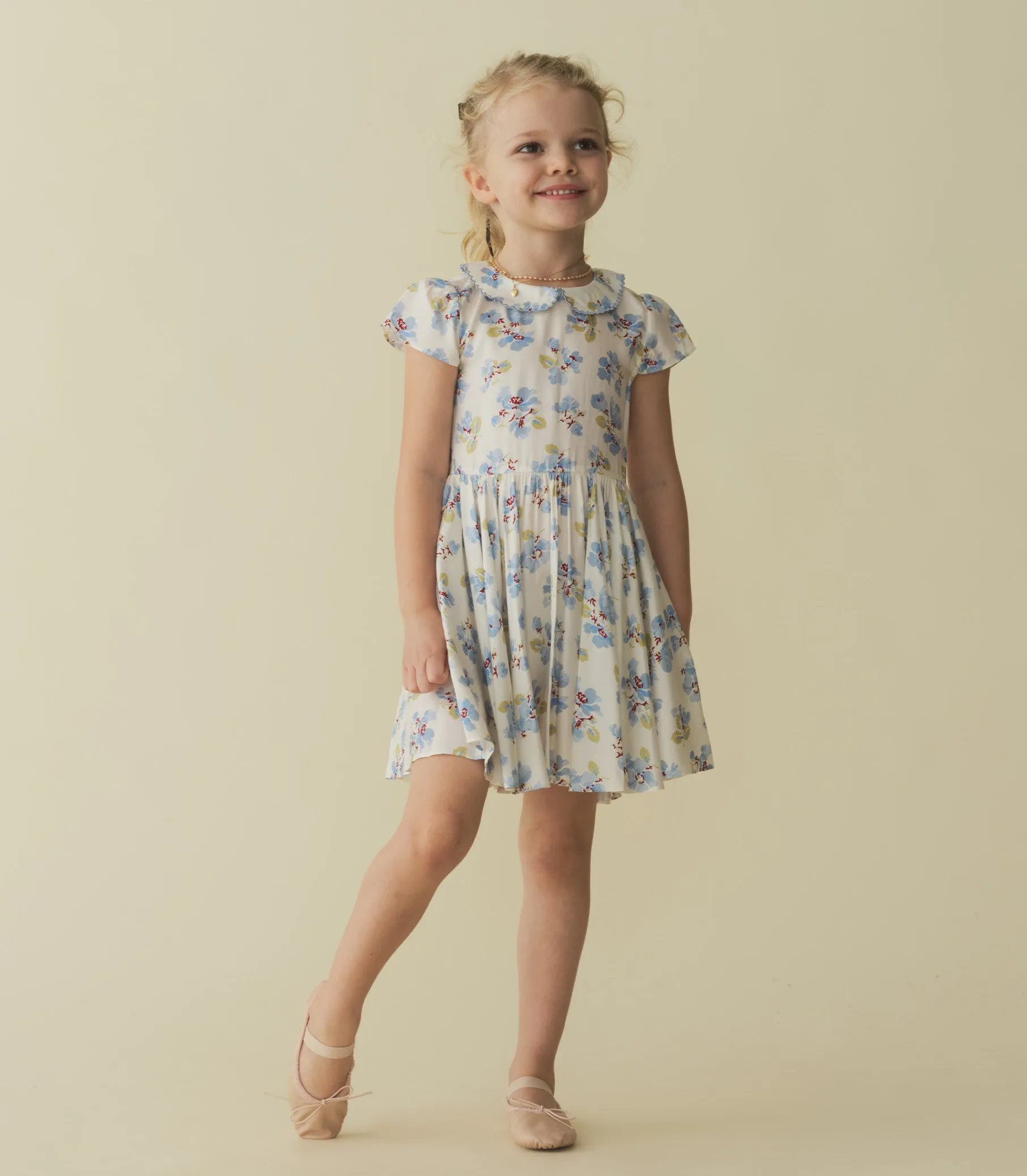 DORA DRESS -- BLEU FROLICKING FLORAL sold by Doen