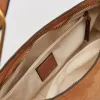 AUDRI SHOULDER BAG RUSTY OAK SUEDE sold by Dolce Vita